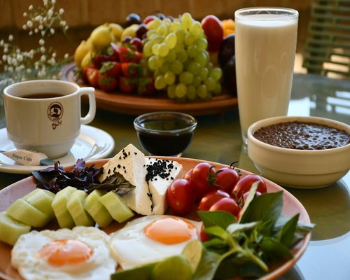 Balanced breakfast with eggs flatbread tea and fresh fruit
